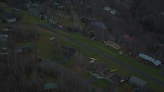 4K aerial stock footage flying by neighborhood near landing strip, winter, Chugiak, Alaska Aerial Stock Footage | AK0001_0711