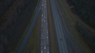 4K aerial stock footage flying low over heavy traffic, Glenn Highway, Alaska, twilight Aerial Stock Footage | AK0001_0720