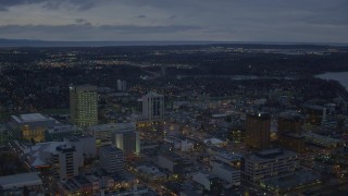 4K aerial stock footage flying by buildings near shoreline, winter, Downtown Anchorage, Alaska, twilight Aerial Stock Footage | AK0001_0732