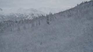 4K aerial stock footage reveal Eagle River Valley, snowy Chugach Mountains, Eagle River, Alaska Aerial Stock Footage | AK0001_0747