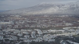 4K aerial stock footage Eagle River Valley neighborhoods, Chugach Mountains, winter, Eagle River, Alaska Aerial Stock Footage | AK0001_0748