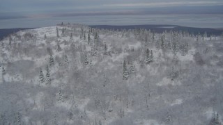 4K aerial stock footage fly over a snowy slope to reveal Chugiak, Chugach Mountains, Alaska Aerial Stock Footage | AK0001_0756