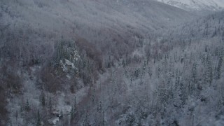 4K aerial stock footage video descending into valley, revealing river, winter, Chugach Mountains, Alaska Aerial Stock Footage | AK0001_0760