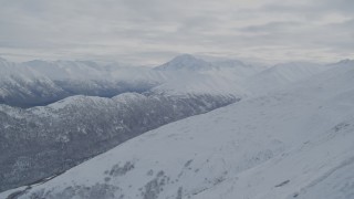 4K aerial stock footage flyby forested valleys and snowy Chugach Mountains, Alaska Aerial Stock Footage | AK0001_0771