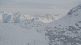 4K aerial stock footage flying by snow-covered Chugach Mountains, Alaska Aerial Stock Footage | AK0001_0775