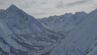 4K aerial stock footage approaching valley bordered by snowy Chugach Mountains, Alaska Aerial Stock Footage | AK0001_0800