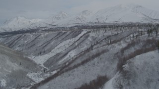 4K aerial stock footage video fly over gorge near the snow-covered Chugach Mountains, Alaskan Wilderness Aerial Stock Footage | AK0001_0884