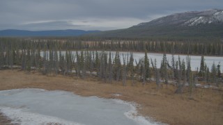 4K aerial stock footage fly over frozen rivers, ponds, and forest in winter, Tazlina River Valley, Alaska Aerial Stock Footage | AK0001_0895