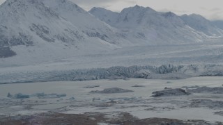 AK0001_0915 - 4K aerial stock footage flying by snow covered Chugach Mountains, Tazlina Glacier, Alaska