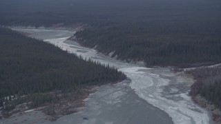 4K aerial stock footage the icy Tazlina River surrounded by evergreen forest, Alaska Aerial Stock Footage | AK0001_1044