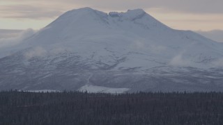 4K aerial stock footage a snow covered Talkeetna Mountain peak, Alaskan Wilderness Aerial Stock Footage | AK0001_1050