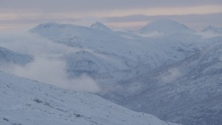 4K aerial stock footage flying over a snowy slope in the Chugach Mountains, Alaska Aerial Stock Footage | AK0001_1059