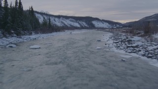 4K aerial stock footage flying along Matanuska River in the snowy Matanuska River Valley, Alaska Aerial Stock Footage | AK0001_1076