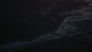 4K aerial stock footage heavy traffic crossing Glenn Highway bridge at night, in snow, Alaska Aerial Stock Footage | AK0001_1141