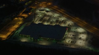 4K aerial stock footage shopping center by Glenn Highway/Highway 1, Eagle River, Alaska, night Aerial Stock Footage | AK0001_1144