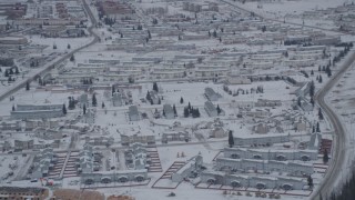 4K aerial stock footage approaching snow covered neighborhoods in Fort Richardson, Anchorage, Alaska Aerial Stock Footage | AK0001_1153