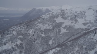 4K aerial stock footage flying toward snowy mountains summit in the Chugach Mountains, Alaska Aerial Stock Footage | AK0001_1170