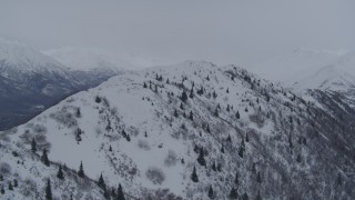 4K aerial stock footage flying toward a snowy range in the Chugach Mountains, Alaska Aerial Stock Footage | AK0001_1180