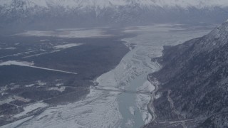 AK0001_1212 - 4K aerial stock footage Old Glenn Highway bridge, snowy Knik River Valley near Butte, Alaska