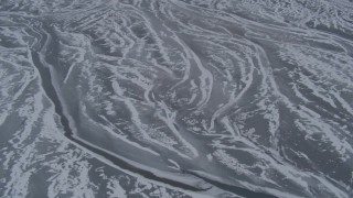 4K aerial stock footage flying over rivers in the snow covered Knik River Valley, Alaska Aerial Stock Footage | AK0001_1229