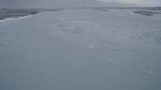 4K aerial stock footage flying low following an icy river, Knik River Valley, Alaska Aerial Stock Footage | AK0001_1269