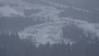 4K aerial stock footage a neighborhood and trees in falling snow, Anchorage, Alaska Aerial Stock Footage | AK0001_1321