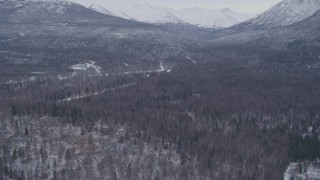 4K aerial stock footage flying over snow covered country roads through woods, Anchorage, Alaska Aerial Stock Footage | AK0001_1333