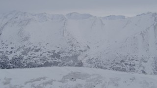 4K aerial stock footage approaching snow covered Chugach Mountains, Alaska Aerial Stock Footage | AK0001_1342