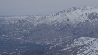 4K aerial stock footage the snow covered Chugach Mountains near Eagle River, Alaska Aerial Stock Footage | AK0001_1343