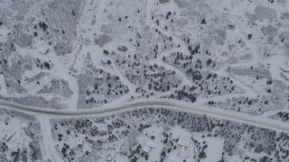 4K aerial stock footage bird's eye view of homes and snowy mountain slope, Eagle River, Alaska Aerial Stock Footage | AK0001_1344