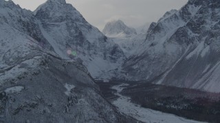 AK0001_1365 - 4K aerial stock footage rivers and trees in snow covered Chugach Mountains, Alaska