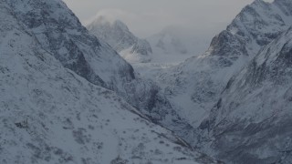 4K aerial stock footage snow covered Chugach Mountains and low clouds, Alaska Aerial Stock Footage | AK0001_1366