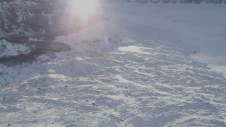 4K aerial stock footage the edge of the snow covered Knik Glacier at base of Chugach Mountains, Alaska Aerial Stock Footage | AK0001_1393