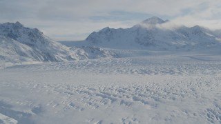 4K aerial stock footage the snow covered Knik Glacier spilling down the Chugach Mountains, Alaska Aerial Stock Footage | AK0001_1399