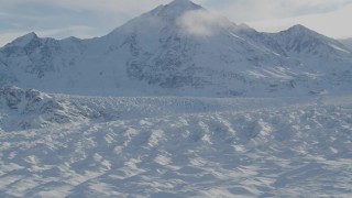 4K aerial stock footage zoom out revealing snow covered Knik Glacier, Chugach Mountains, Alaska Aerial Stock Footage | AK0001_1401