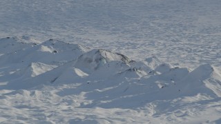 4K aerial stock footage the snow covered raised ridge along Knik Glacier, Alaska Aerial Stock Footage | AK0001_1403