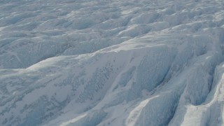 4K aerial stock footage the jagged, snow covered surface of the Knik Glacier, Alaska Aerial Stock Footage | AK0001_1426