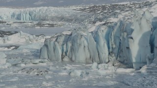 AK0001_1475 - 4K aerial stock footage ice on Inner Lake George along edge of snow covered glacier, Alaska