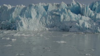 AK0001_1481 - 4K aerial stock footage flying over icy surface of Inner Lake George toward snow covered glacier, Alaska