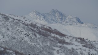 4K aerial stock footage a snow covered, rocky peak of the Chugach Mountains, Alaska Aerial Stock Footage | AK0001_1485