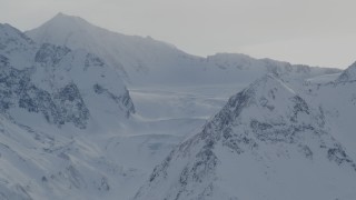 4K aerial stock footage a snowy valley surrounded by Chugach Mountains, Alaska Aerial Stock Footage | AK0001_1489