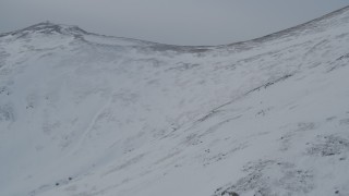 4K aerial stock footage flying over snowy slopes of the Chugach Mountains, Alaska Aerial Stock Footage | AK0001_1491