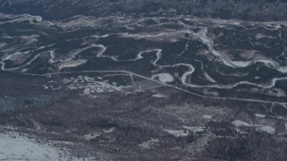 4K aerial stock footage Eagle River surrounded by forest and homes in snow, Alaska Aerial Stock Footage | AK0001_1504