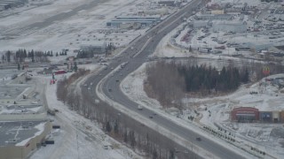 4K aerial stock footage Glenn Highway, 5th Avenue, snowy Merrill Field, Downtown Anchorage, Alaska Aerial Stock Footage | AK0001_1518