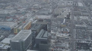 4K aerial stock footage flyby glass office building in snow covered Downtown Anchorage, Alaska Aerial Stock Footage | AK0001_1527