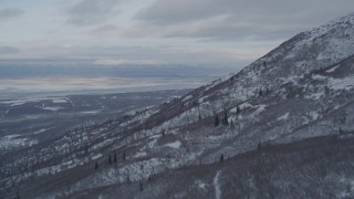 4K aerial stock footage flying over snowy mountain slopes in Chugach Mountains, Alaska Aerial Stock Footage | AK0001_1539