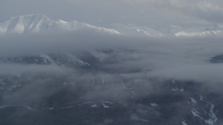 4K aerial stock footage approach clouds and snowy Chugach Mountains in winter, Alaska  Aerial Stock Footage | AK0001_1550