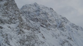 4K aerial stock footage flying by rocky, snow covered mountain summits, Chugach Mountains, Alaska Aerial Stock Footage | AK0001_1559