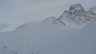 4K aerial stock footage flying up a snowy mountain slope, Chugach Mountains, Alaska Aerial Stock Footage | AK0001_1561