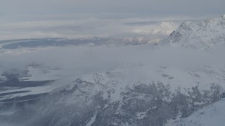 4K aerial stock footage snow covered Knik Fairview, Knik River Valley from Chugach Mountains, Alaska Aerial Stock Footage | AK0001_1563